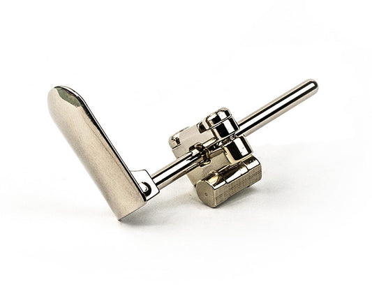 A close-up view of a French horn flipper part, essential for horn players.